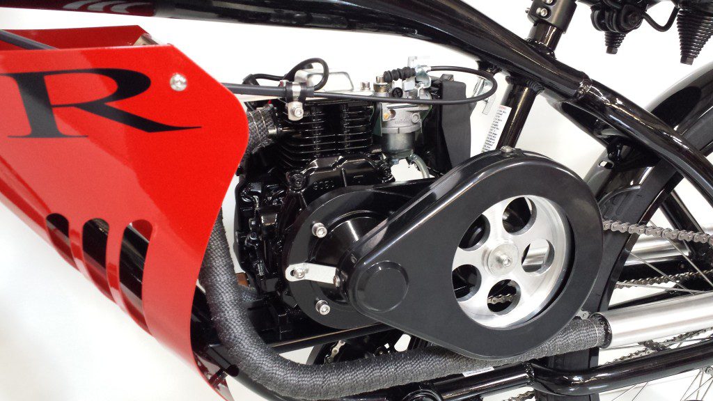 A close up of a motorcycle with a red and black engine.