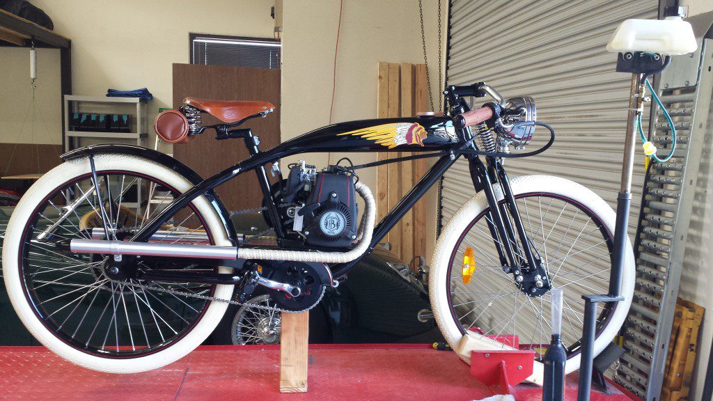 An E bike on display standing on a stand with rider