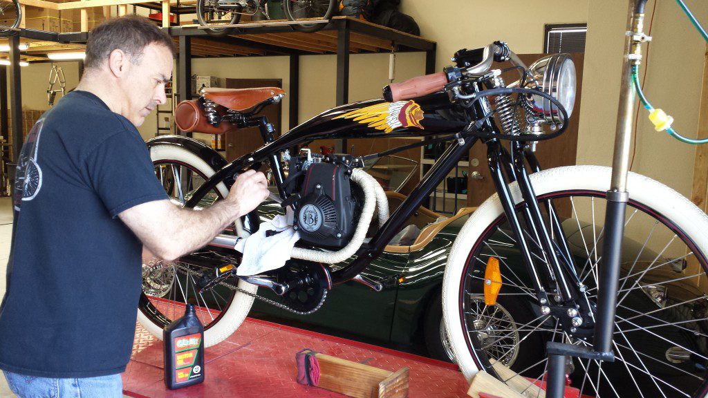 An E bike on display standing on a stand with rider