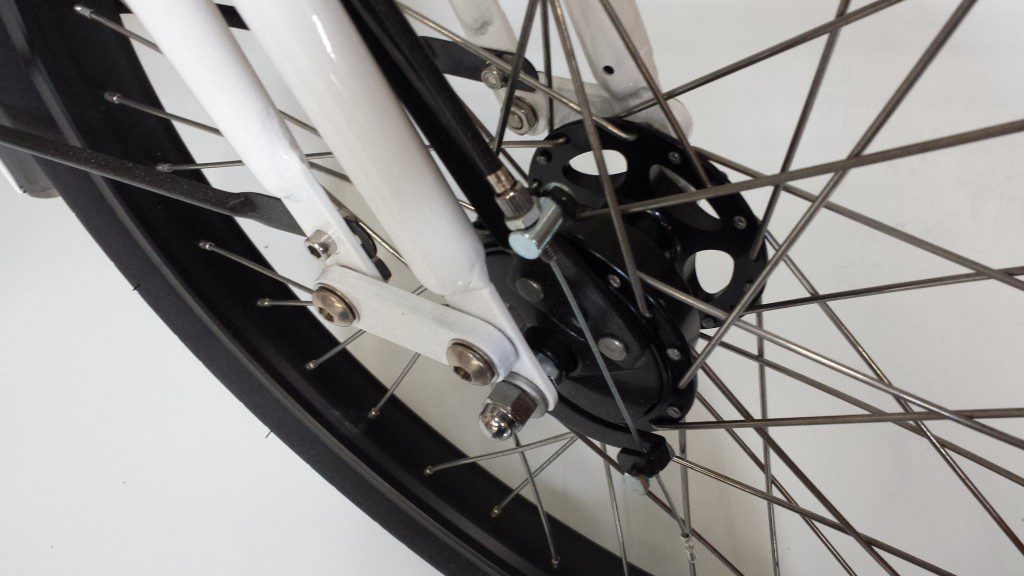 A close up of the wheel on a bicycle.