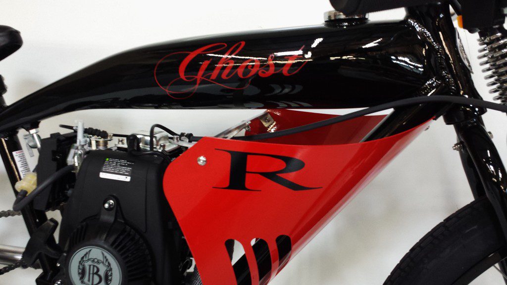 A black and red motorcycle with the word ghost on it.