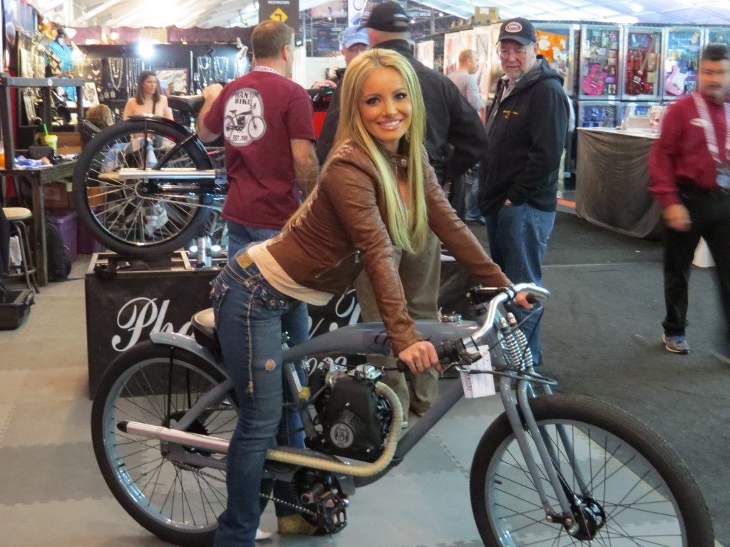 A woman on a bike at an exhibition place