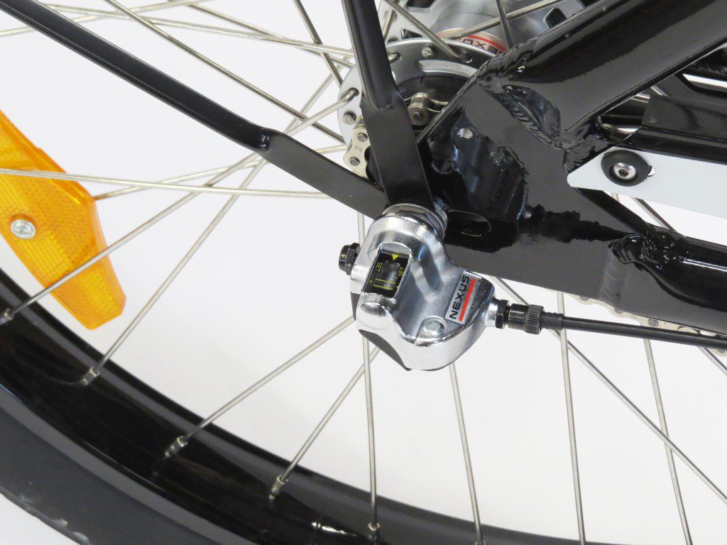 A close up of a bicycle's front wheel.