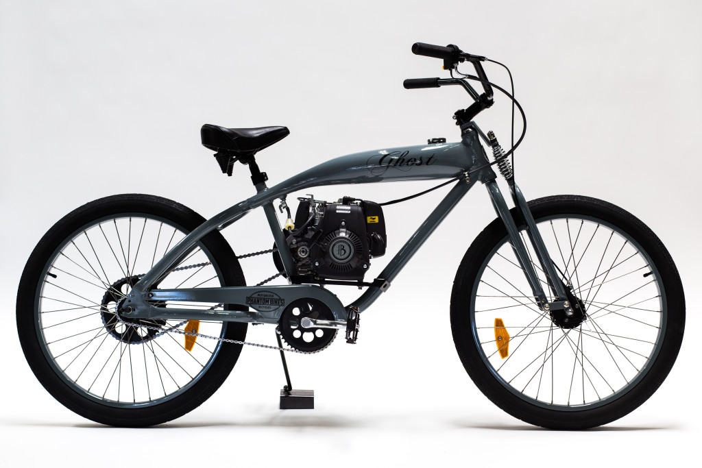 A gray bike with a motor is shown against a white background.