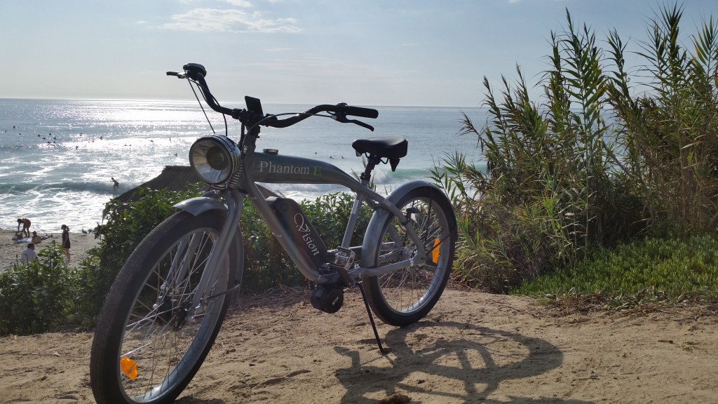 A bike parked on the beach.