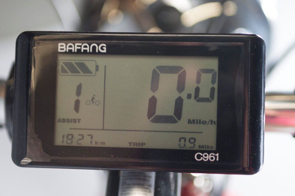 A bicycle with a digital display on the handlebars.