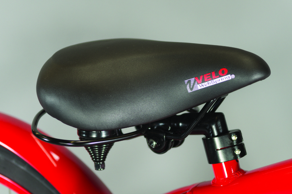 A close up of the seat of a red bicycle.