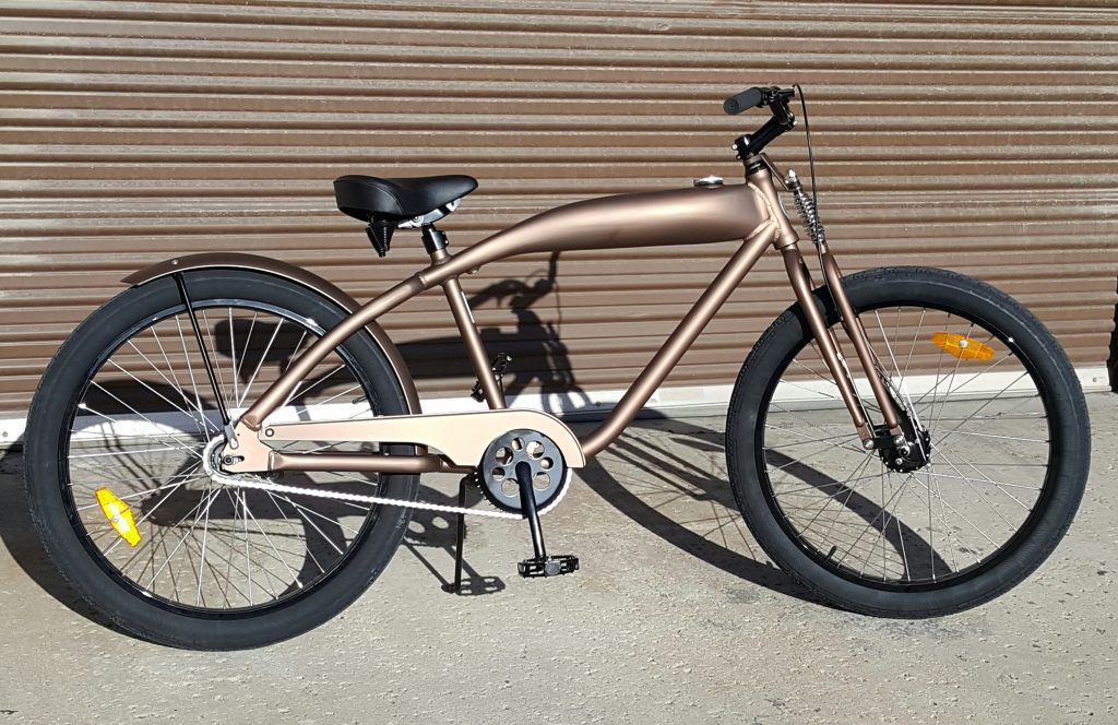 A brown bike parked outside of a garage.