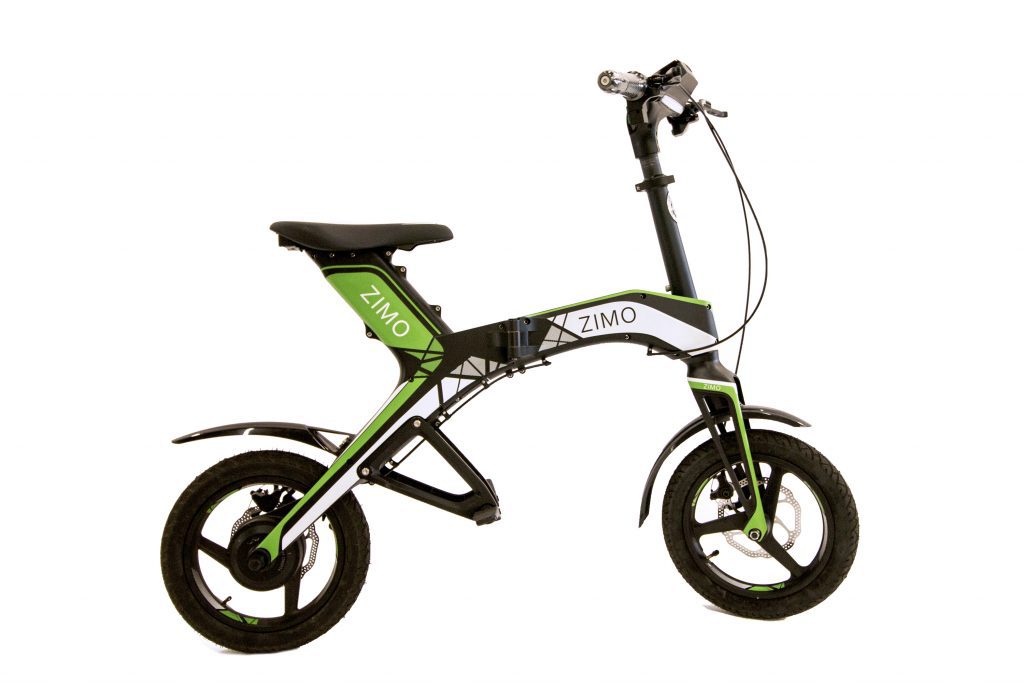 A green and black folding bike on a white background.