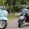 Two Adventure Scooter In Different Color On The Street