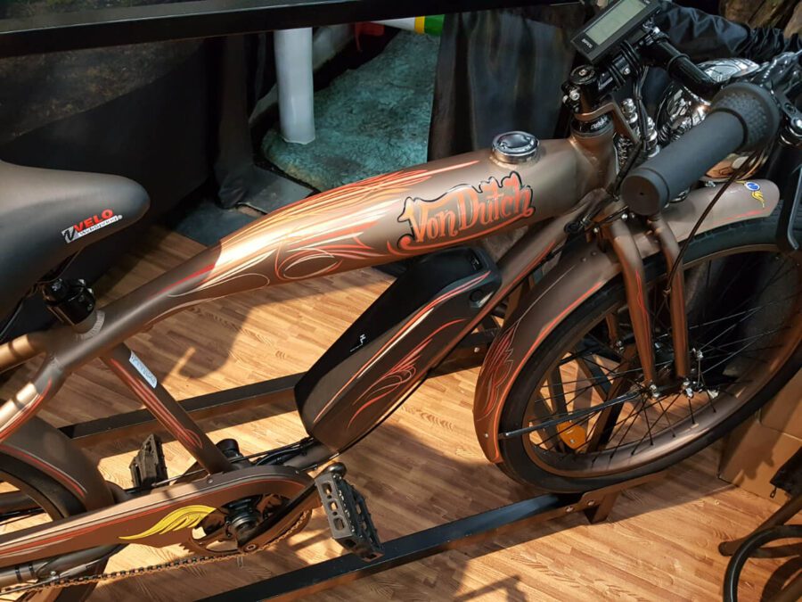 An electric bike is on display at a show.