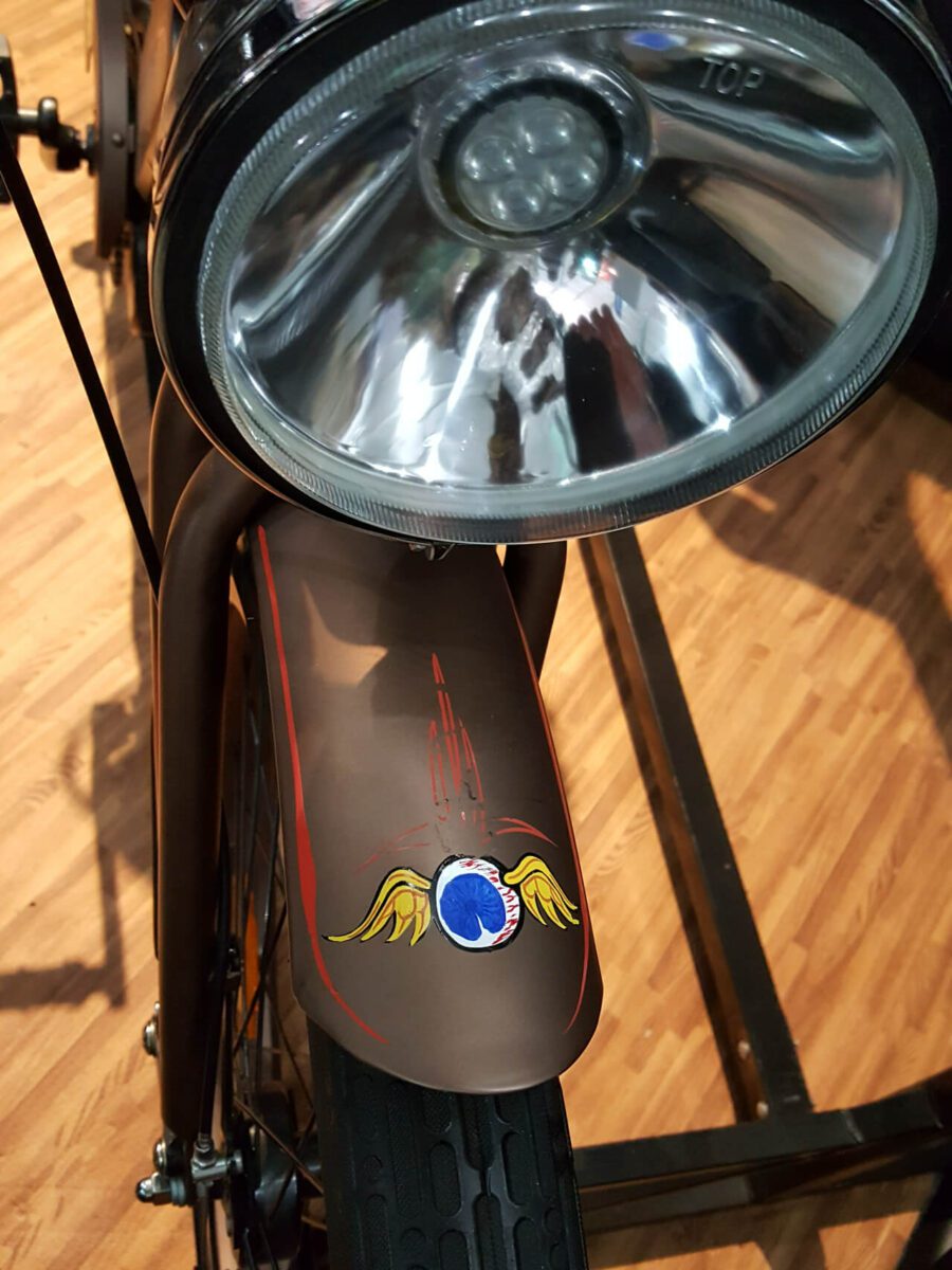 A close up of a motorcycle with a decal on it.